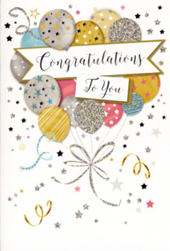 This photograph features a sophisticated congratulations card designed with the same care a Dollis Hill florist might bring to arranging a celebratory bouquet. The composition is dominated by a generous cluster of illustrated balloons that rise from the lower portion of the card and gather toward the centre, creating a focal point full of energy and warmth. Each balloon is a rounded oval, shaded in complementary tones of gold, silver, champagne, sky blue, rose pink, and soft grey. Some balloons shimmer with an all-over glitter effect, others carry tiny metallic stars scattered across their surface, while a few are dressed in gentle stripes or dotted accents, all outlined in fine, gleaming metallic ink that suggests texture and luxury. From the base of the balloon cluster, slender ribbons in shining gold and silver tumble down in loose curls, giving a sense of motion, like streamers caught in a light breeze drifting over Dollis Hill's tree-lined streets. Across the middle of the balloons curves a graceful banner, slightly raised in appearance, carrying the message Congratulations To You in elegant, flowing script that feels warm, confident, and celebratory without being overly loud. Surrounding the central design, tiny stars, flecks of confetti, and sweeping swirls are scattered over a pale, uncluttered background, evoking the feeling of a surprise party or a champagne toast after good news. The lighting in the image is soft and even, allowing the metallic accents to catch a subtle glow rather than a harsh shine. It's the kind of card that pairs beautifully with fresh flowers for graduations, promotions, or a new chapter worth honouring, whether the recipient lives near Gladstone Park or tucked along one of Dollis Hill's quiet residential roads.